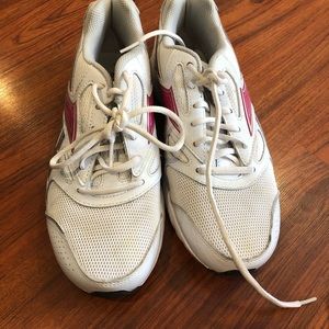 Pink and white Reebok tennis shoes